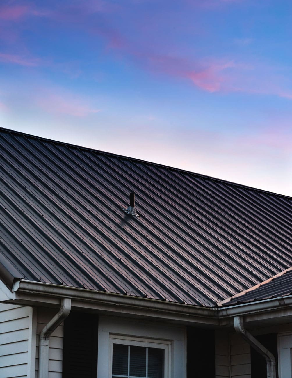a-beautiful-house-metal-roof-during-the-sunset-2025-02-09-20-04-55-utc